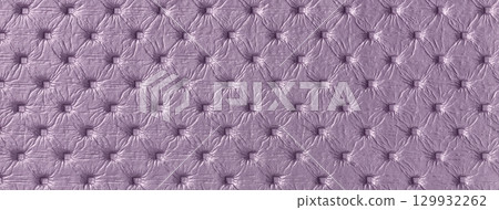 Violet leather texture with capitone pattern, macro background of purple retro Chesterfield vintage textile fabric Violet leather texture with capitone pattern, macro background of purple retro Chesterfield vintage textile fabric 129932262