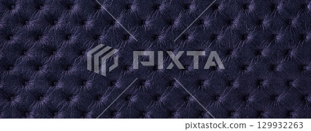 Dark violet leather texture with capitone pattern, macro background of indigo retro Chesterfield vintage textile fabric Dark violet leather texture with capitone pattern, macro background of indigo retro Chesterfield vintage textile fabric 129932263