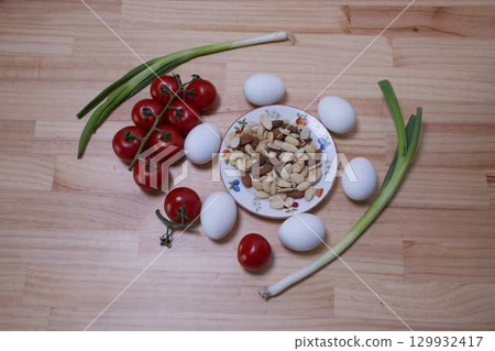 Healthy food on the table: eggs, nuts, tomatoes Healthy food on the table: eggs, nuts, tomatoes 129932417