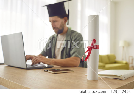 Online learning and teaching marketplace, graduation scroll close up, diploma certificate rolled Online learning and teaching marketplace, graduation scroll close up, diploma certificate rolled 129932494