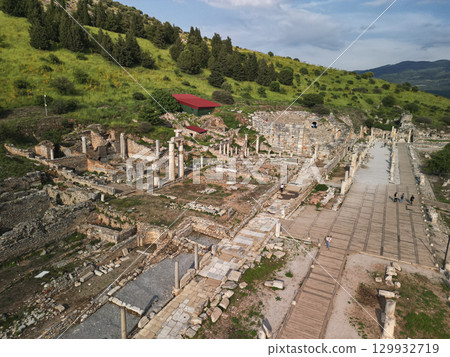 Roman columns and hillside ruins along the marble avenue in Ephesus, Turkey Roman columns and hillside ruins along the marble avenue in Ephesus, Turkey 129932719