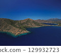 Aerial view of twin bays and rugged peninsula with pine slopes in mugla, turkiye 129932723