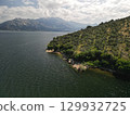 Green peninsula coastline and clear water on bafa lake, aydin province, Turkey 129932725
