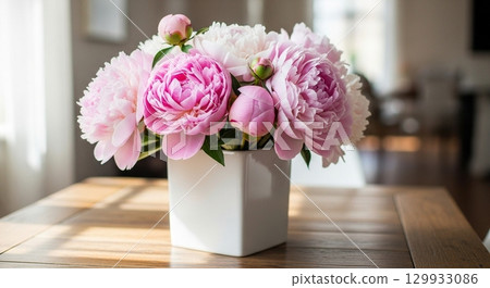 Pink flowers on a windowsill Pink flowers on a windowsill 129933086