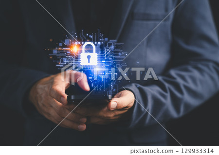 Close-up of a person holding a smartphone with a glowing digital padlock icon, symbolizing mobile cybersecurity, data protection, encryption, and secure digital communication in modern technology. 129933314