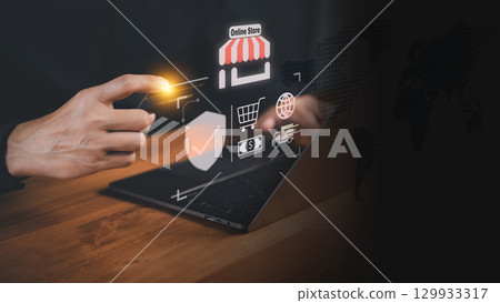 Customer holding a credit card while using a laptop with virtual shopping icons. Business concept of secure online transactions, e-commerce, digital payments, and modern financial technology systems. Customer holding a credit card while using a laptop with virtual shopping icons. Business concept of secure online transactions, e-commerce, digital payments, and modern financial technology systems. 129933317