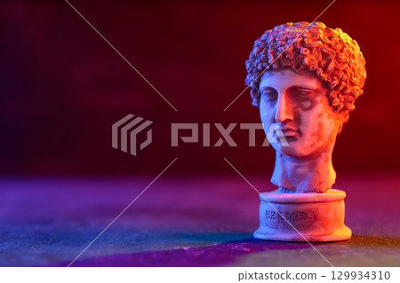 Hermes Sculpture Head with Neon Lighting on Dark Background 129934310