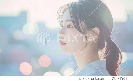 Young woman looking to the future in the light, pastel colors 129935031