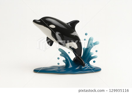Killer whale jumping on the water 129935116