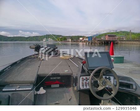 View from the cockpit of a bass boat on the lake View from the cockpit of a bass boat on the lake 129935846