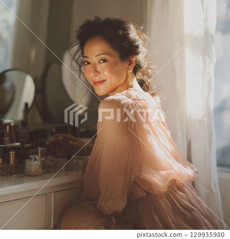 A stylish, beautiful Japanese woman relaxing by the window (square photo) 129935980