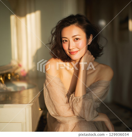 A stylish, beautiful Japanese woman relaxing by the window (square photo) 129936034
