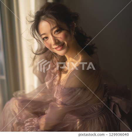 A stylish, beautiful Japanese woman relaxing by the window (square photo) 129936040