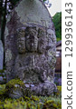 Mossy stone statue 129936143