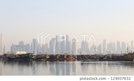 Morning view of the Corniche, Doha, Qatar - dhows and modern skyline 129937632