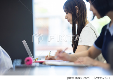 Students studying on tablets 129937827