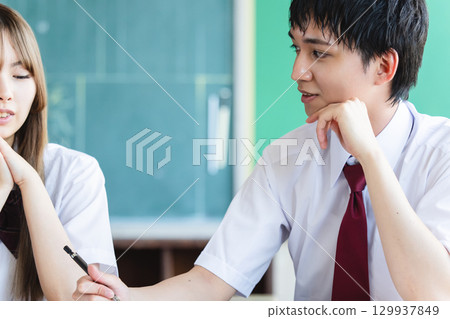 Students studying in classroom 129937849