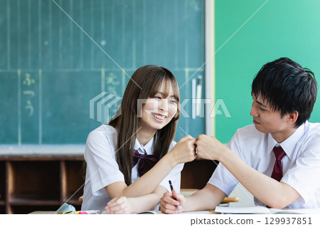 Students studying in classroom 129937851
