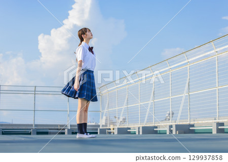 School girls looking up at the sky 129937858