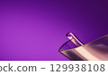 Abstract background with dynamic glass-like surface in pink and gold tones. 129938108