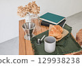 Bread and coffee on the table 129938238