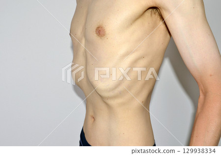 Skinny naked man's upper body 129938334