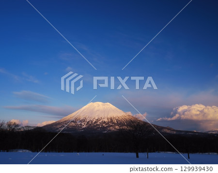 Winter in Niseko, Hokkaido: View of Mount Yotei in the evening light from Takahashi Ranch 129939430