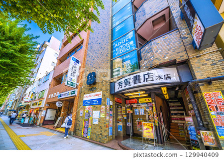 Tokyo cityscape in Japan: Kanda Jinbocho, a used bookstore district lined with shops facing north. There's a bar under the stairs... (August 21st) 129940409