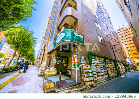 Tokyo cityscape in Japan: Kanda Jinbocho, Jinbocho Station, with its rows of second-hand bookstores facing north (on the left sidewalk). ... = August 21st 129940669