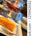 An afternoon of tea with apple pie as a snack 129942682