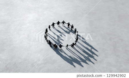 Aerial view of people standing in a circle on the ground 129942902