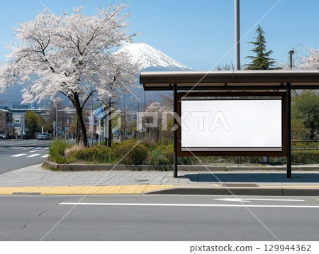 The blank billboard at the Japan bus stop station with Fuji mountain and Sakura on the background 129944362