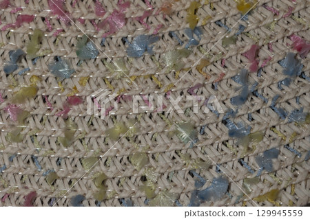 Colorful Woven Texture With Pastel Highlights in Intricate Patterns on Fabric 129945559