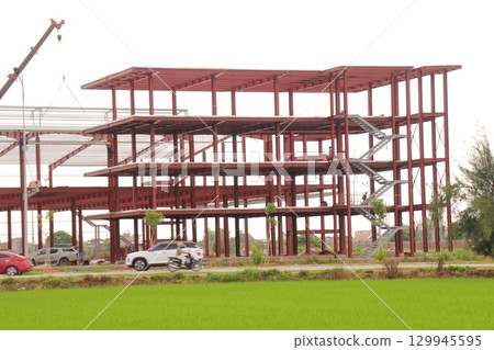 on construction site in vietnam. Construction workers. Machinery is digging the ground on construction site in vietnam. Construction workers. Machinery is digging the ground 129945595