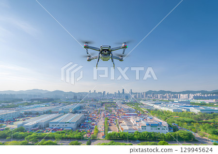 A drone flying over the industrial park 129945624