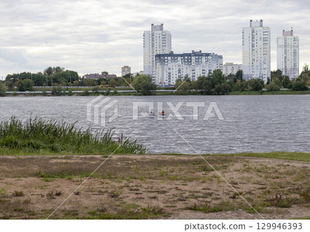 People practicing rowing on the lake. Sports 129946393