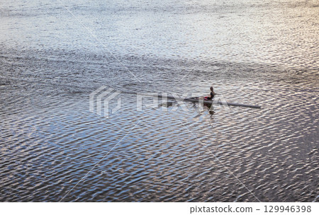People practicing rowing on the lake. Sports 129946398