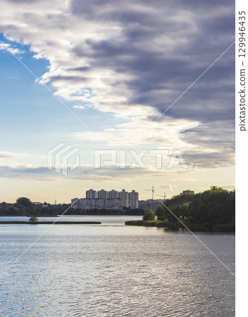 Sunset hour by the lake. Outdoors 129946435