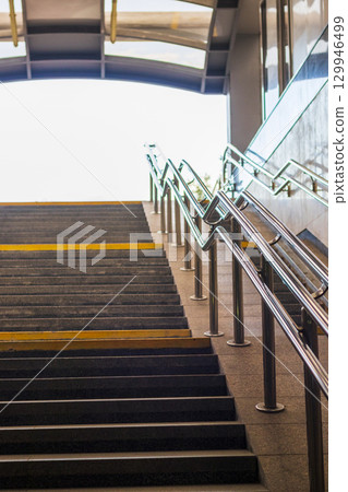Stairs and rails of the underground pedestrian crossing Stairs and rails of the underground pedestrian crossing 129946499