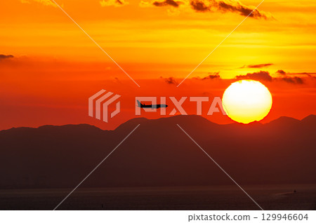 Sunset and airplane Sunset and airplane 129946604