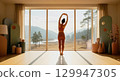 Serene rear view of a woman stretching arms overhead in a modern minimalist room with large window 129947305