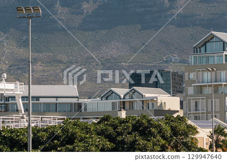 Cape Town waterfront cityscape, buildings and Table Mountain in clouds. South Africa 129947640