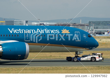 Frankfurt, Germany, July 9, 2017: Close-Up of Vietnam Airlines Boeing 787 on Taxiway Tow Frankfurt, Germany, July 9, 2017: Close-Up of Vietnam Airlines Boeing 787 on Taxiway Tow 129947982