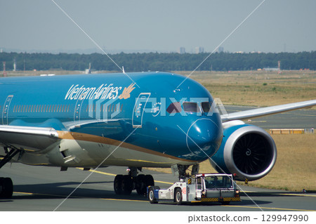 Frankfurt, Germany, July 9, 2017: Close-Up of Vietnam Airlines Boeing 787 on Taxiway Tow Frankfurt, Germany, July 9, 2017: Close-Up of Vietnam Airlines Boeing 787 on Taxiway Tow 129947990