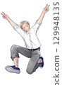 Male student jumping with joy, smiling 129948135