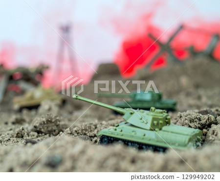 Miniature Tank in a War Scene, dominate a scene of simulated conflict 129949202