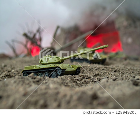 Miniature Tanks in a War Scene, dominate a scene of simulated conflict 129949203