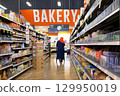 Motion of people shopping for food inside price smart foods store at barkery corridor 129950019