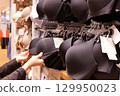Motion of woman buying bra inside uniqlo store 129950023