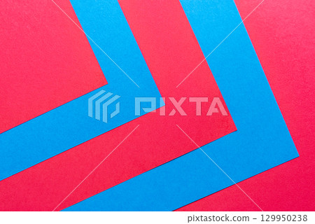 Overlapping blue and red construction paper 129950238